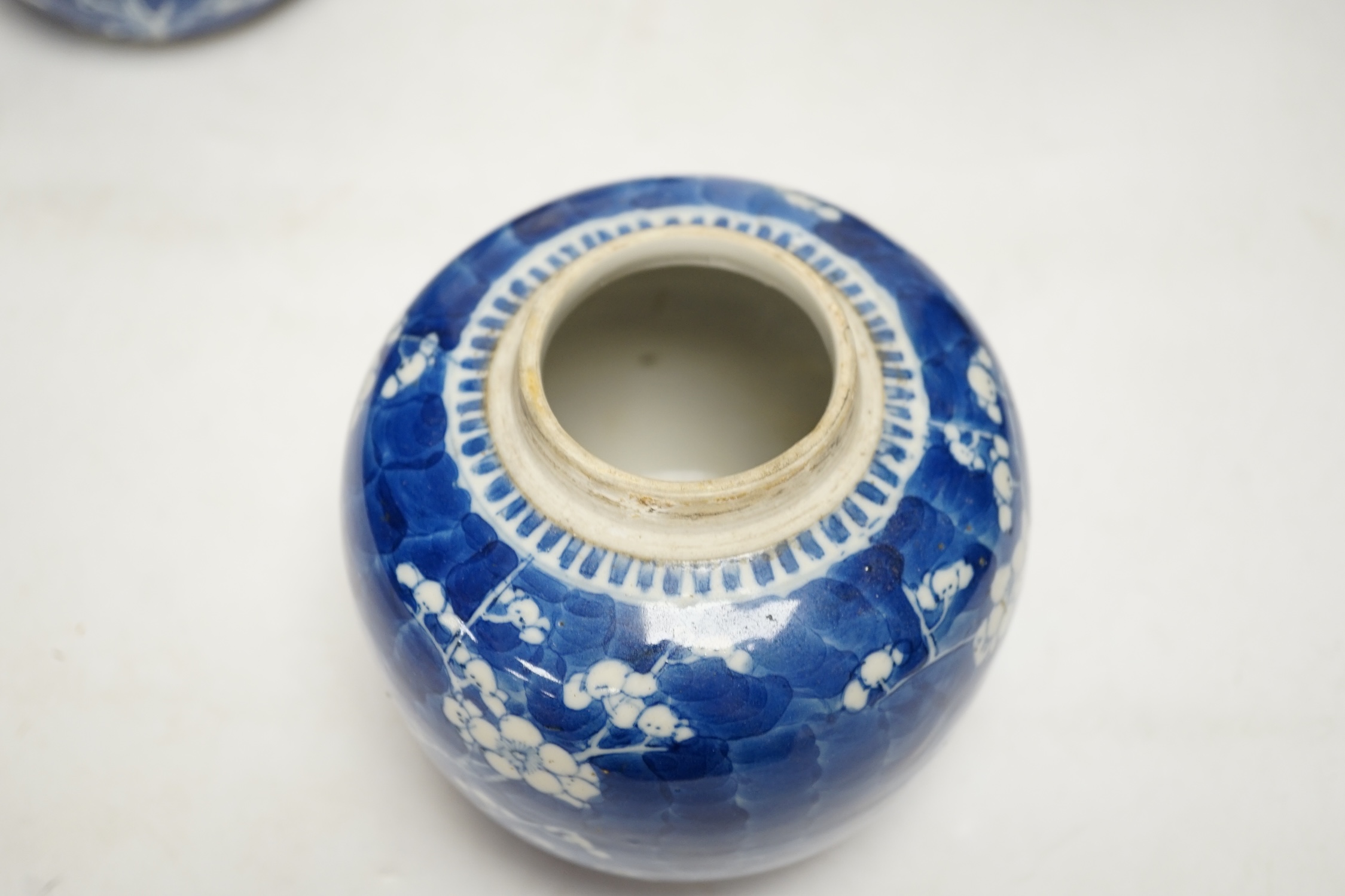 Four Chinese blue and white prunus jars and covers, tallest 15cm high. Condition - good